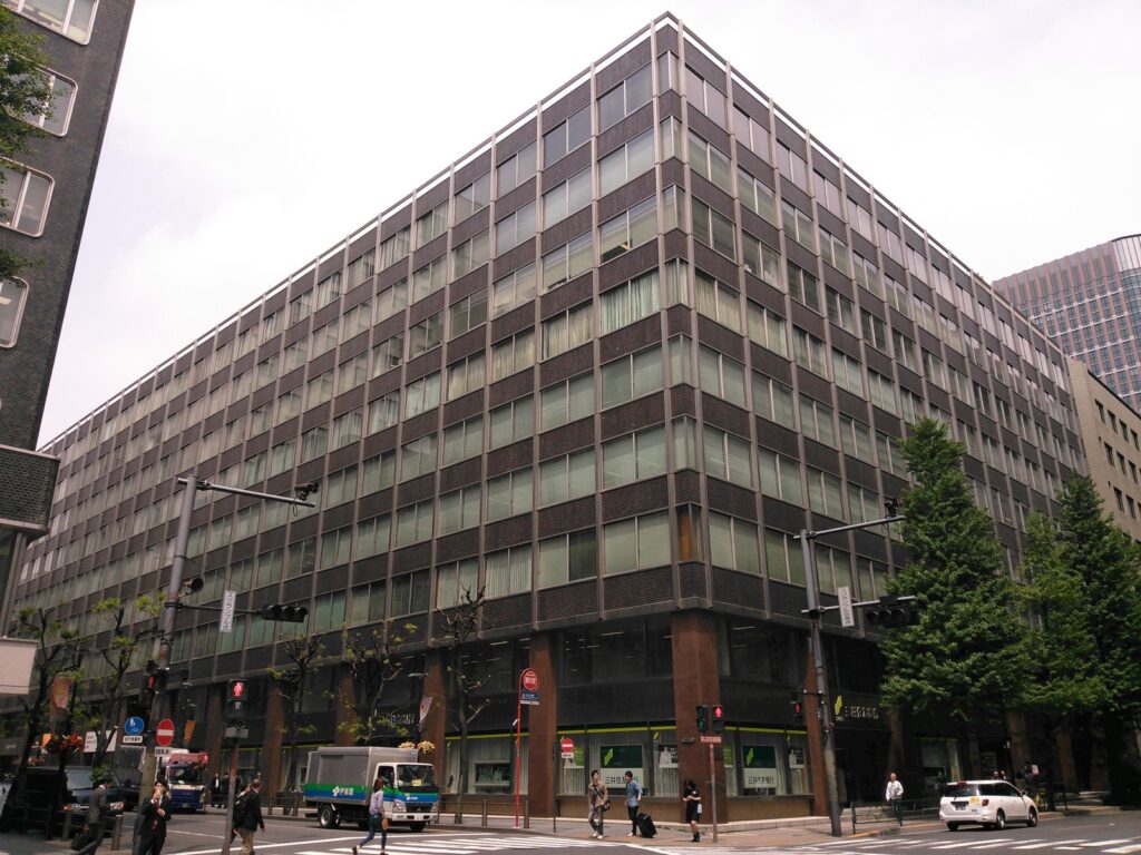 Shin-Kokusai office building at a Tokyo street corner, context for Japan annual leave